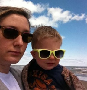 I didn't have a camera with me this morning, so here's me and the boy from the same vantage point.  Lake Michigan is truly lovely--alone or with cute company.